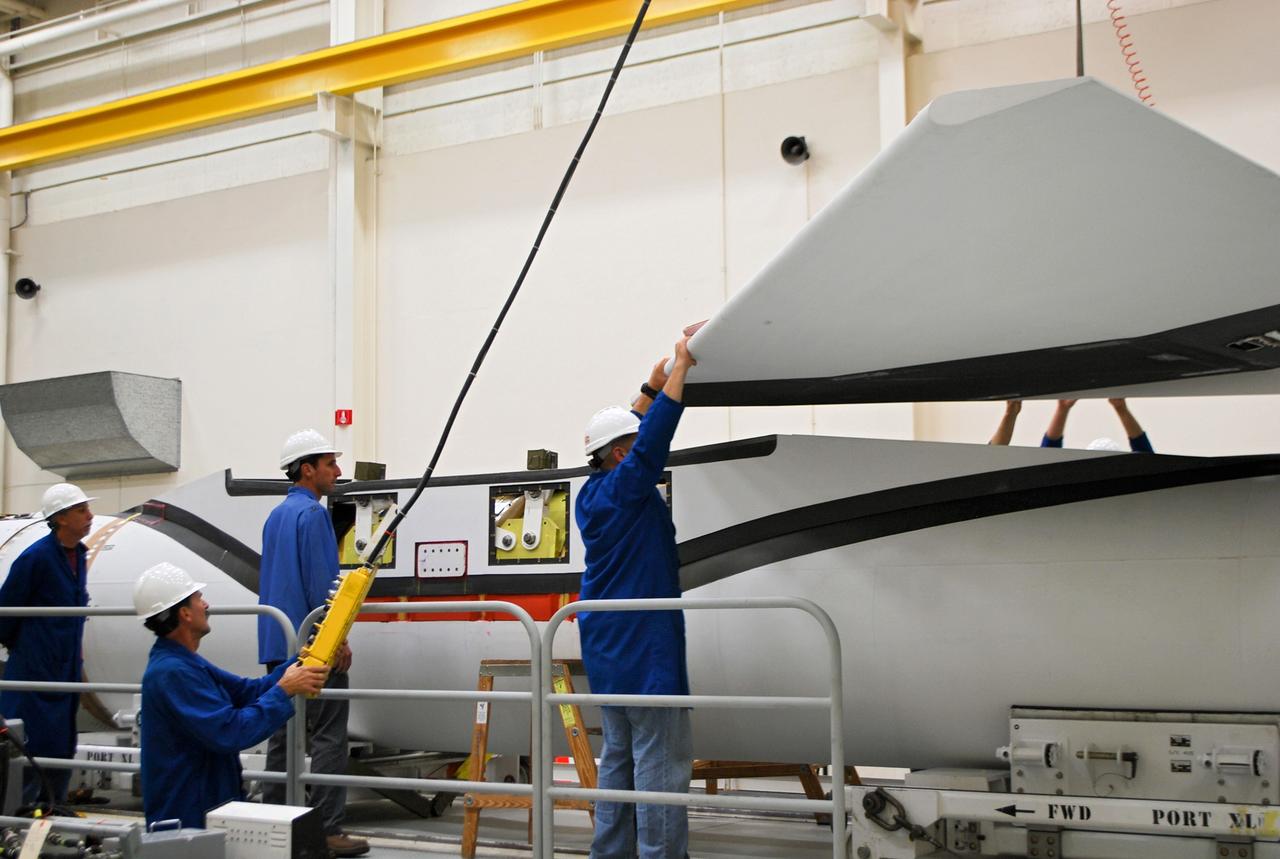 VANDENBERG AIR FORCE BASE, Calif. – At Vandenberg Air Force Base in California, technicians install the wing on the Orbital Sciences Corp. Pegasus XL rocket which will launch the Interface Region Imaging Spectrograph, or IRIS, spacecraft.      Scheduled for launch from Vandenberg Air Force Base no earlier than Feb. 27, 2013, IRIS will open a new window of discovery by tracing the flow of energy and plasma through the chromospheres and transition region into the sun’s corona using spectrometry and imaging. IRIS fills a crucial gap in our ability to advance studies of the sun-to-Earth connection by tracing the flow of energy and plasma through the foundation of the corona and the region around the sun known as the heliosphere. For more information, visit http://iris.gsfc.nasa.gov Photo credit: NASA/Randy Beaudoin