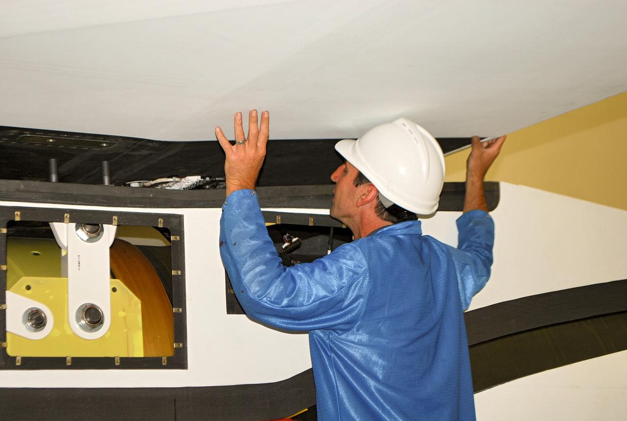 VANDENBERG AIR FORCE BASE, Calif. – At Vandenberg Air Force Base in California, a technician helps install the wing on the Orbital Sciences Corp. Pegasus XL rocket which will launch the Interface Region Imaging Spectrograph, or IRIS, spacecraft.      Scheduled for launch from Vandenberg Air Force Base no earlier than Feb. 27, 2013, IRIS will open a new window of discovery by tracing the flow of energy and plasma through the chromospheres and transition region into the sun’s corona using spectrometry and imaging. IRIS fills a crucial gap in our ability to advance studies of the sun-to-Earth connection by tracing the flow of energy and plasma through the foundation of the corona and the region around the sun known as the heliosphere. For more information, visit http://iris.gsfc.nasa.gov Photo credit: NASA/Randy Beaudoin