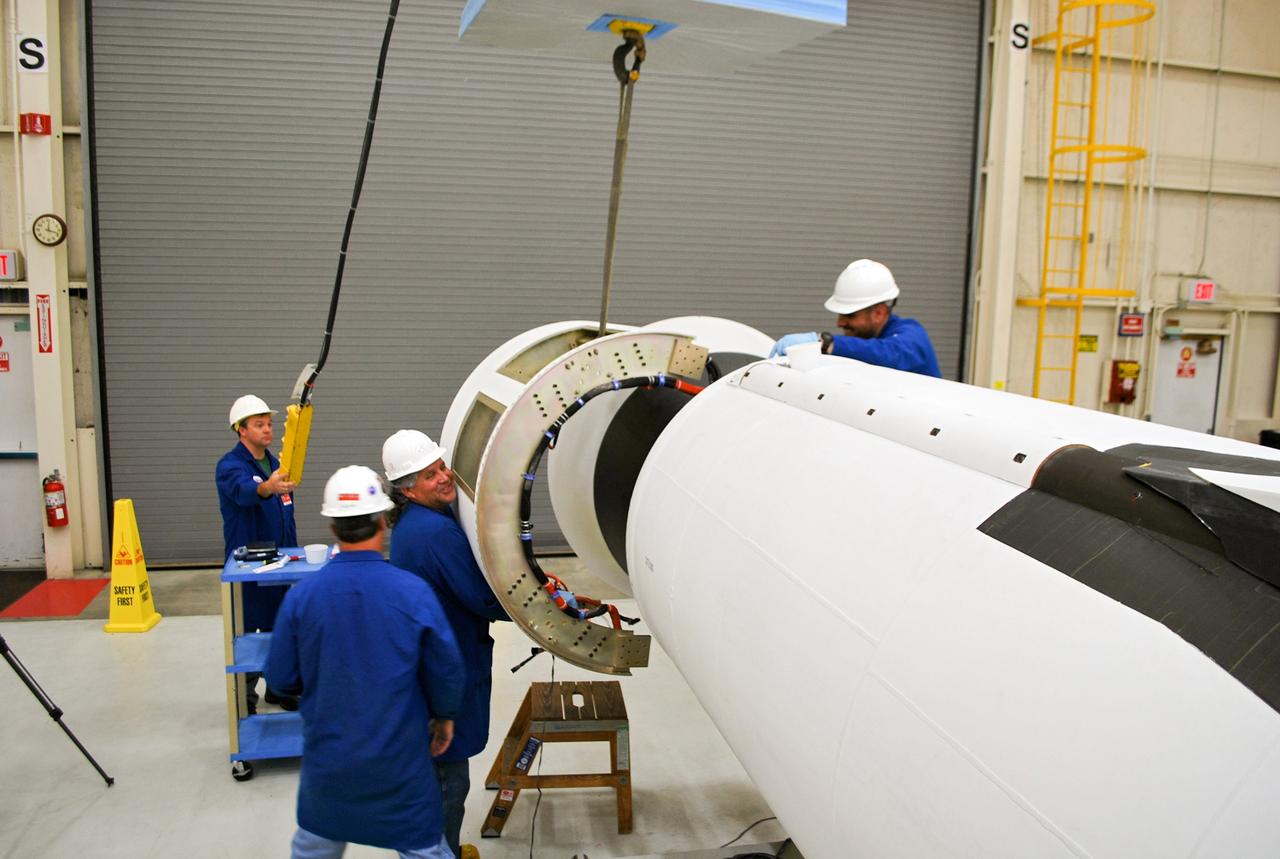 VANDENBERG AIR FORCE BASE, Calif. – At Vandenberg Air Force Base in California, technicians install the aft skirt on the Orbital Sciences Corp. Pegasus XL rocket which will launch the Interface Region Imaging Spectrograph, or IRIS, spacecraft.      Scheduled for launch from Vandenberg Air Force Base no earlier than Feb. 27, 2013, IRIS will open a new window of discovery by tracing the flow of energy and plasma through the chromospheres and transition region into the sun’s corona using spectrometry and imaging. IRIS fills a crucial gap in our ability to advance studies of the sun-to-Earth connection by tracing the flow of energy and plasma through the foundation of the corona and the region around the sun known as the heliosphere. For more information, visit http://iris.gsfc.nasa.gov Photo credit: NASA/Randy Beaudoin