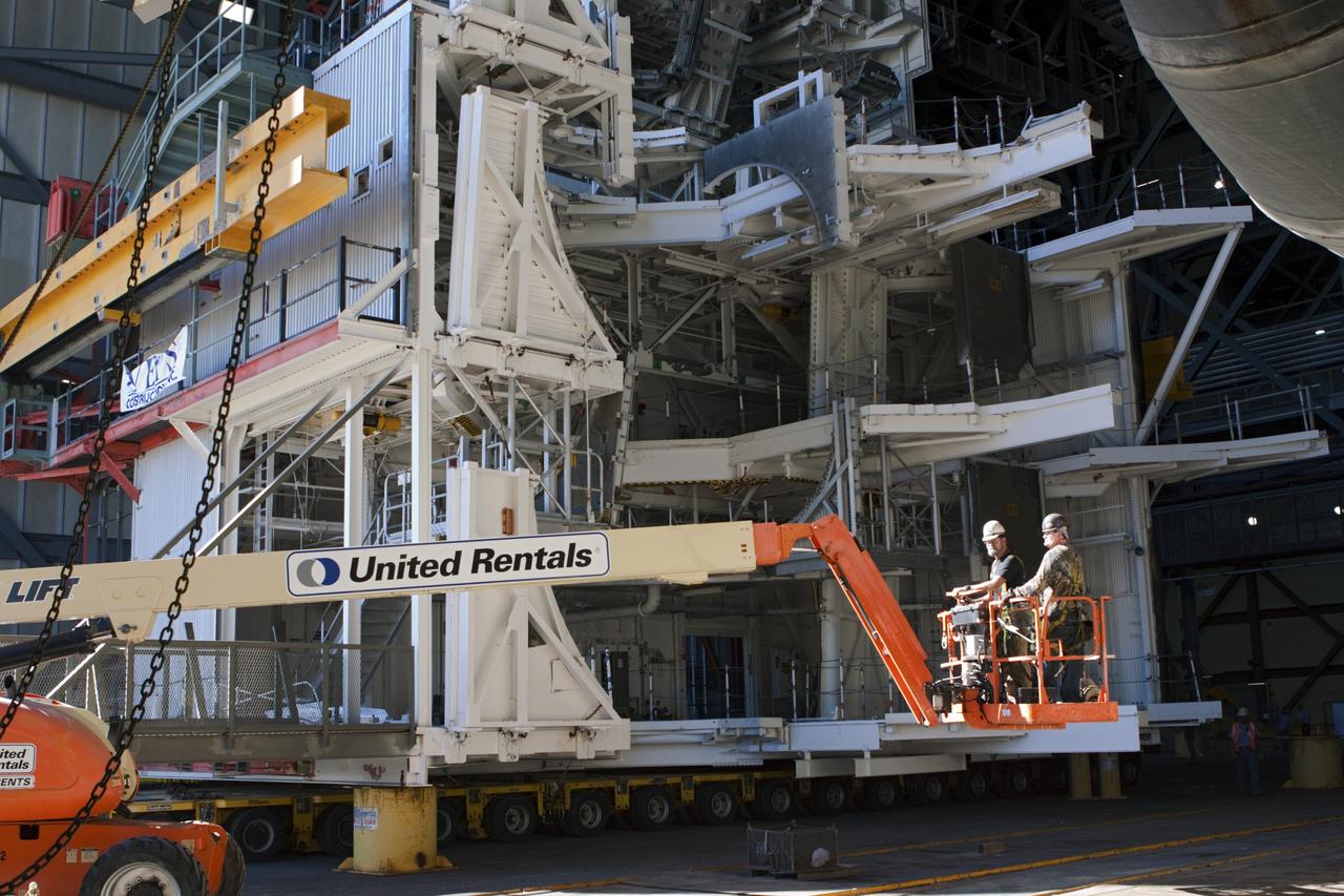 CAPE CANAVERAL, Fla. – As part of NASA's Ground Systems Development and Operations Program at the Kennedy Space Center in Florida, a large space shuttle-era work platform is being inspected prior to removal from high bay 3 of the Vehicle Assembly Building, or VAB. The work is part of a center-wide modernization and refurbishment initiative to accommodate NASA’s Space Launch System and a variety of other spacecraft instead of the whole building supporting one design. The Ground Systems Development and Operations Program is developing the necessary ground systems, infrastructure and operational approaches required to safely process, assemble, transport and launch the next generation of rockets and spacecraft in support of NASA’s exploration objectives. Future work also will replace the antiquated communications, power and vehicle access resources with modern efficient systems. Some of the utilities and systems slated for replacement have been used since the VAB opened in 1965. For more information, visit http://www.nasa.gov/exploration/systems/ground/index.html Photo credit: NASA/Jim Grossmann