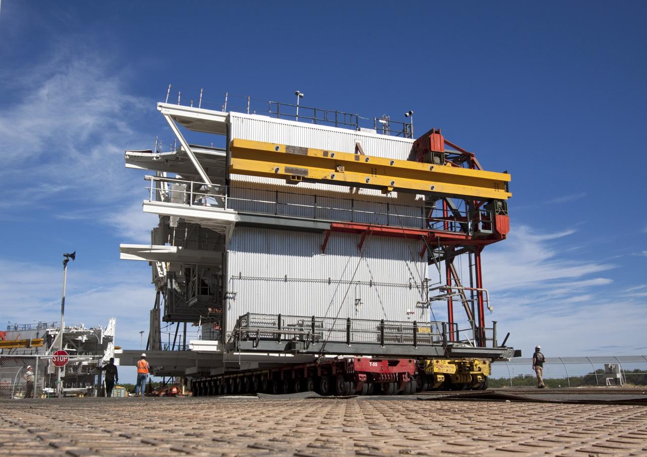 CAPE CANAVERAL, Fla. – As part of NASA's Ground Systems Development and Operations Program at the Kennedy Space Center in Florida, a large space shuttle-era work platform has been removed from high bay 3 of the Vehicle Assembly Building, or VAB. The work is part of a center-wide modernization and refurbishment initiative to accommodate NASA’s Space Launch System and a variety of other spacecraft instead of the whole building supporting one design. The Ground Systems Development and Operations Program is developing the necessary ground systems, infrastructure and operational approaches required to safely process, assemble, transport and launch the next generation of rockets and spacecraft in support of NASA’s exploration objectives. Future work also will replace the antiquated communications, power and vehicle access resources with modern efficient systems. Some of the utilities and systems slated for replacement have been used since the VAB opened in 1965. For more information, visit http://www.nasa.gov/exploration/systems/ground/index.html Photo credit: NASA/Jim Grossmann