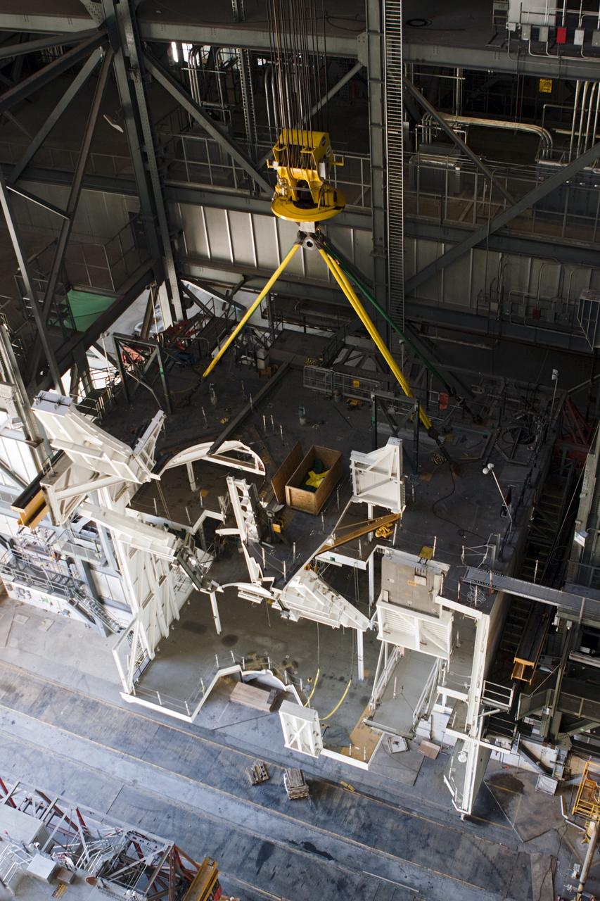 CAPE CANAVERAL, Fla. – As part of NASA's Ground Systems Development and Operations Program at the Kennedy Space Center in Florida, a large space shuttle-era work platform is being removed from high bay 3 of the Vehicle Assembly Building, or VAB. The work is part of a center-wide modernization and refurbishment initiative to accommodate NASA’s Space Launch System and a variety of other spacecraft instead of the whole building supporting one design. The Ground Systems Development and Operations Program is developing the necessary ground systems, infrastructure and operational approaches required to safely process, assemble, transport and launch the next generation of rockets and spacecraft in support of NASA’s exploration objectives. Future work also will replace the antiquated communications, power and vehicle access resources with modern efficient systems. Some of the utilities and systems slated for replacement have been used since the VAB opened in 1965. For more information, visit http://www.nasa.gov/exploration/systems/ground/index.html Photo credit: NASA/Jim Grossmann