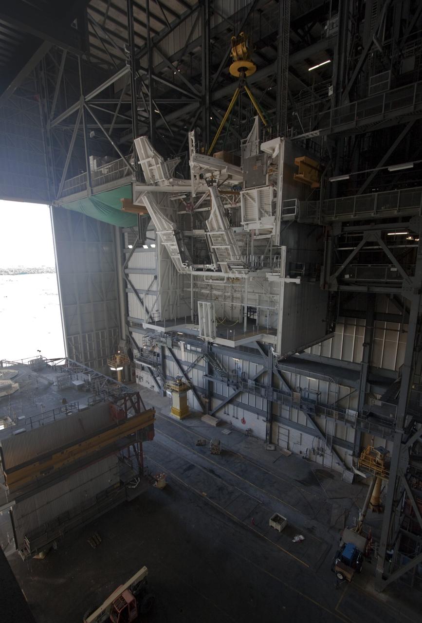 CAPE CANAVERAL, Fla. – As part of NASA's Ground Systems Development and Operations Program at the Kennedy Space Center in Florida, a large space shuttle-era work platform is being removed from high bay 3 of the Vehicle Assembly Building, or VAB. The work is part of a center-wide modernization and refurbishment initiative to accommodate NASA’s Space Launch System and a variety of other spacecraft instead of the whole building supporting one design. The Ground Systems Development and Operations Program is developing the necessary ground systems, infrastructure and operational approaches required to safely process, assemble, transport and launch the next generation of rockets and spacecraft in support of NASA’s exploration objectives. Future work also will replace the antiquated communications, power and vehicle access resources with modern efficient systems. Some of the utilities and systems slated for replacement have been used since the VAB opened in 1965. For more information, visit http://www.nasa.gov/exploration/systems/ground/index.html Photo credit: NASA/Jim Grossmann