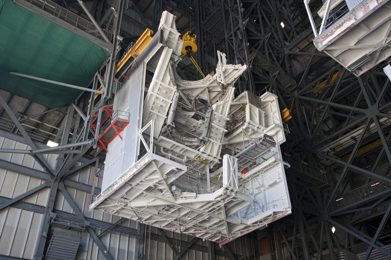 CAPE CANAVERAL, Fla. – As part of NASA's Ground Systems Development and Operations Program at the Kennedy Space Center in Florida, a large space shuttle-era work platform is being removed from high bay 3 of the Vehicle Assembly Building, or VAB. The work is part of a center-wide modernization and refurbishment initiative to accommodate NASA’s Space Launch System and a variety of other spacecraft instead of the whole building supporting one design. The Ground Systems Development and Operations Program is developing the necessary ground systems, infrastructure and operational approaches required to safely process, assemble, transport and launch the next generation of rockets and spacecraft in support of NASA’s exploration objectives. Future work also will replace the antiquated communications, power and vehicle access resources with modern efficient systems. Some of the utilities and systems slated for replacement have been used since the VAB opened in 1965. For more information, visit http://www.nasa.gov/exploration/systems/ground/index.html Photo credit: NASA/Jim Grossmann