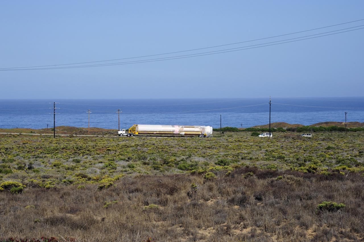 VANDENBERG AFB, Calif. – A truck moves the first stage booster of a United Launch Alliance Atlas V to Space Launch Complex-3E at Vandenberg Air Force Base, Calif. in preparation for the launch of the Landsat Data Continuity Mission. The Landsat Data Continuity Mission, or LDCM, is the future of Landsat satellites. It will continue to obtain valuable data and imagery to be used in agriculture, education, business, science, and government. The Landsat Program provides repetitive acquisition of high resolution multispectral data of the Earth's surface on a global basis. The data from the Landsat spacecraft constitute the longest record of the Earth's continental surfaces as seen from space. It is a record unmatched in quality, detail, coverage, and value. Launch is planned for Feb. 2013. Photo credit: NASA/Roy Allison