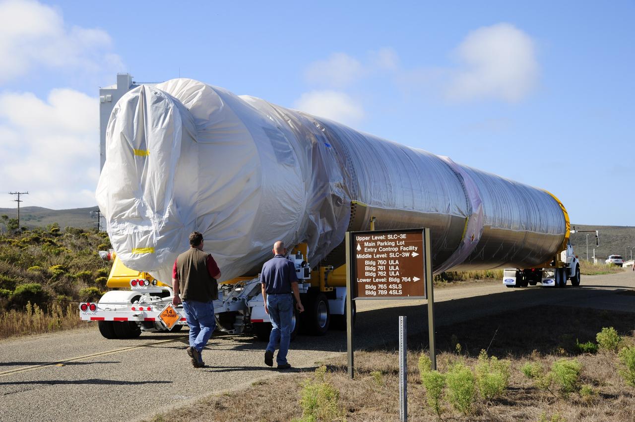 VANDENBERG AFB, Calif. – A truck moves the first stage booster of a United Launch Alliance Atlas V to Space Launch Complex-3E at Vandenberg Air Force Base, Calif. in preparation for the launch of the Landsat Data Continuity Mission. The Landsat Data Continuity Mission, or LDCM, is the future of Landsat satellites. It will continue to obtain valuable data and imagery to be used in agriculture, education, business, science, and government. The Landsat Program provides repetitive acquisition of high resolution multispectral data of the Earth's surface on a global basis. The data from the Landsat spacecraft constitute the longest record of the Earth's continental surfaces as seen from space. It is a record unmatched in quality, detail, coverage, and value. Launch is planned for Feb. 2013. Photo credit: NASA/Roy Allison