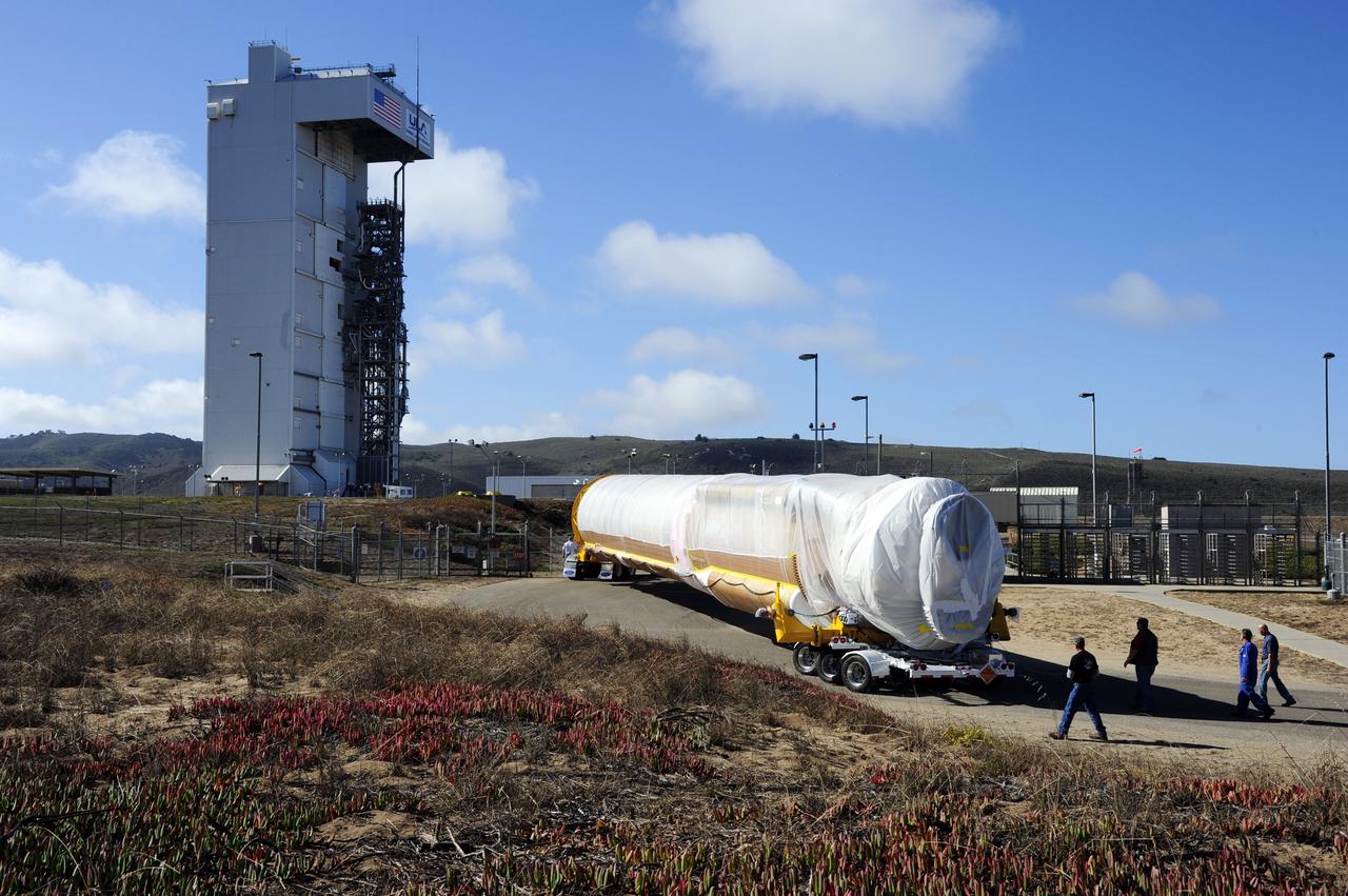 VANDENBERG AFB, Calif. – A truck moves the first stage booster of a United Launch Alliance Atlas V to Space Launch Complex-3E at Vandenberg Air Force Base, Calif. in preparation for the launch of the Landsat Data Continuity Mission. The Landsat Data Continuity Mission, or LDCM, is the future of Landsat satellites. It will continue to obtain valuable data and imagery to be used in agriculture, education, business, science, and government. The Landsat Program provides repetitive acquisition of high resolution multispectral data of the Earth's surface on a global basis. The data from the Landsat spacecraft constitute the longest record of the Earth's continental surfaces as seen from space. It is a record unmatched in quality, detail, coverage, and value. Launch is planned for Feb. 2013. Photo credit: NASA/Roy Allison