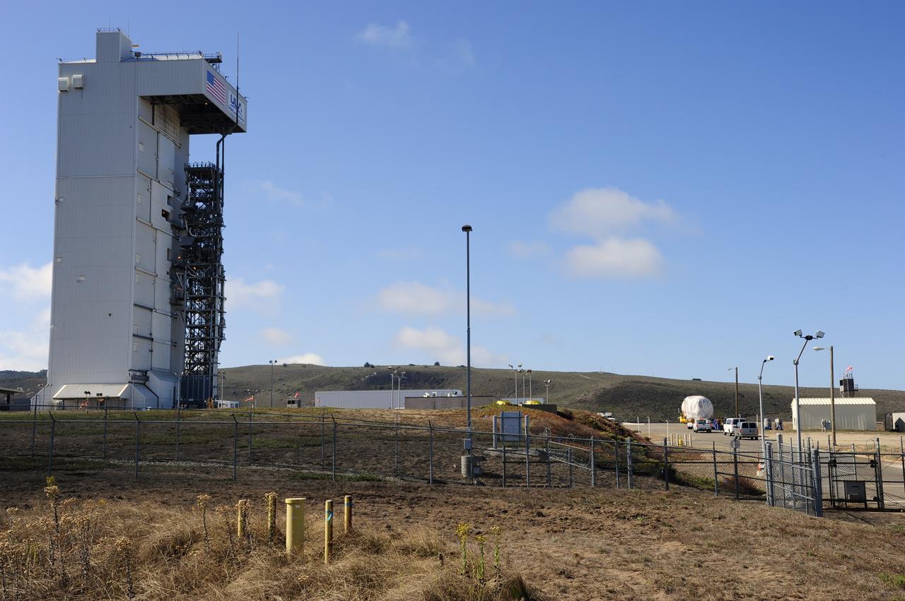 VANDENBERG AFB, Calif. – A truck moves the first stage booster of a United Launch Alliance Atlas V to Space Launch Complex-3E at Vandenberg Air Force Base, Calif. in preparation for the launch of the Landsat Data Continuity Mission. The Landsat Data Continuity Mission, or LDCM, is the future of Landsat satellites. It will continue to obtain valuable data and imagery to be used in agriculture, education, business, science, and government. The Landsat Program provides repetitive acquisition of high resolution multispectral data of the Earth's surface on a global basis. The data from the Landsat spacecraft constitute the longest record of the Earth's continental surfaces as seen from space. It is a record unmatched in quality, detail, coverage, and value. Launch is planned for Feb. 2013. Photo credit: NASA/Roy Allison