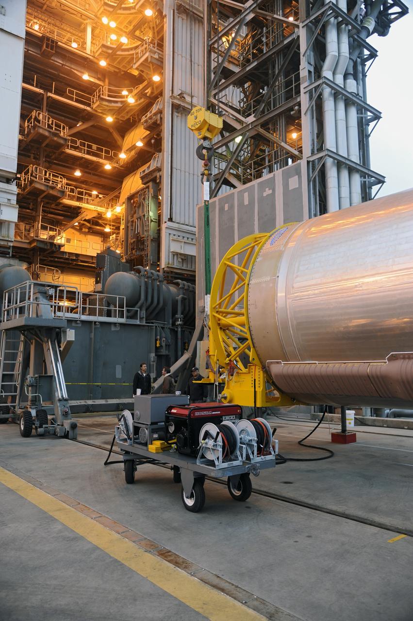 VANDENBERG AFB, Calif. – Technicians prepare to raise the first stage booster of a United Launch Alliance Atlas V onto the launch pad at Space Launch Complex-3E at Vandenberg Air Force Base, Calif. in preparation for the launch of the Landsat Data Continuity Mission.   The Landsat Data Continuity Mission LDCM is the future of Landsat satellites. It will continue to obtain valuable data and imagery to be used in agriculture, education, business, science, and government. The Landsat Program provides repetitive acquisition of high resolution multispectral data of the Earth's surface on a global basis. The data from the Landsat spacecraft constitute the longest record of the Earth's continental surfaces as seen from space. It is a record unmatched in quality, detail, coverage, and value. Launch is planned for Feb. 2013. Photo credit: NASA/Roy Allison