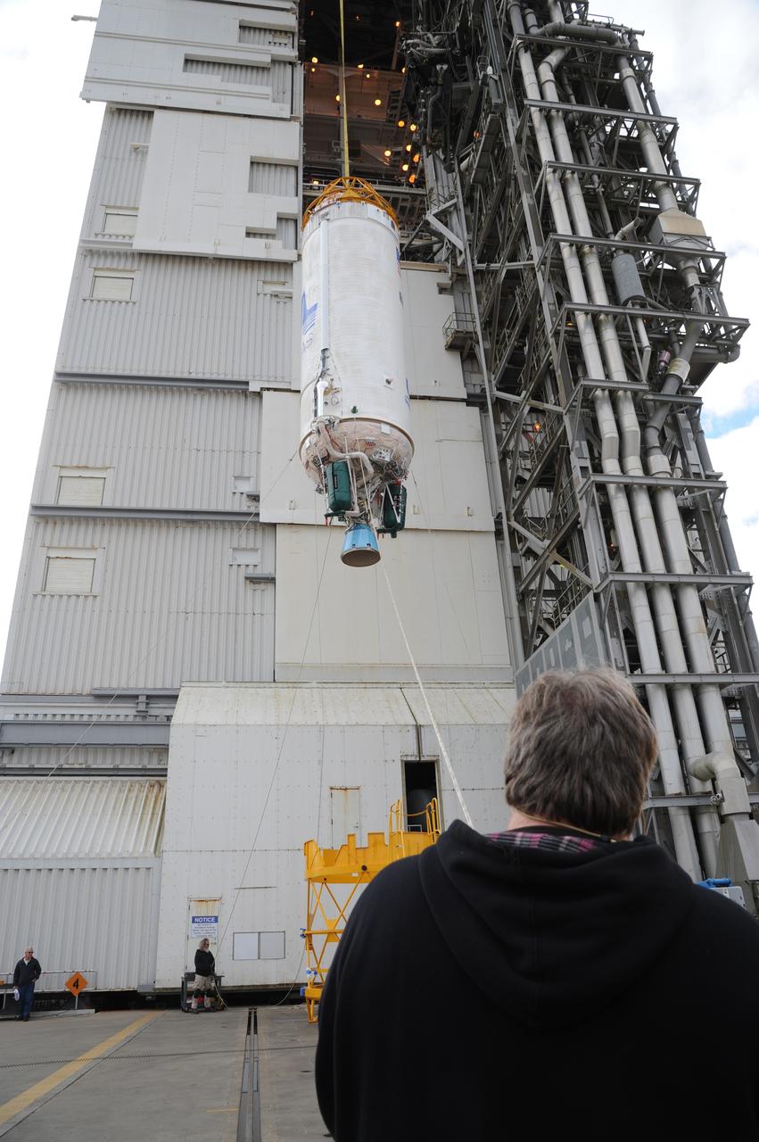 VANDENBERG AFB, Calif. – A Centaur upper stage is lifted onto the first stage booster of a United Launch Alliance Atlas V at the launch pad at Space Launch Complex-3E at Vandenberg Air Force Base, Calif. in preparation for the launch of the Landsat Data Continuation Mission.   The Landsat Data Continuity Mission LDCM is the future of Landsat satellites. It will continue to obtain valuable data and imagery to be used in agriculture, education, business, science, and government. The Landsat Program provides repetitive acquisition of high resolution multispectral data of the Earth's surface on a global basis. The data from the Landsat spacecraft constitute the longest record of the Earth's continental surfaces as seen from space. It is a record unmatched in quality, detail, coverage, and value. Launch is planned for Feb. 2013. Photo credit: NASA/Roy Allison