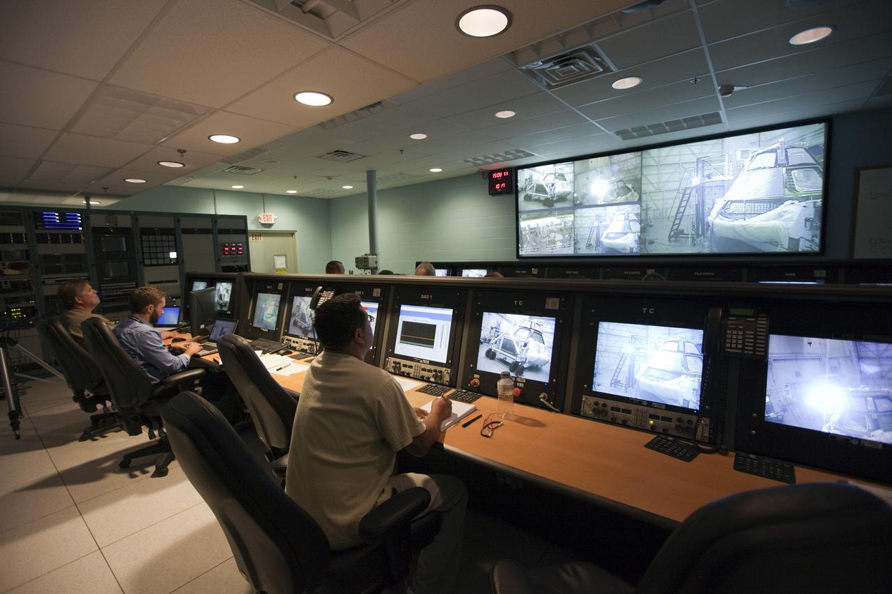 CAPE KENNEDY, Fla. -- Inside the control room at the Launch Equipment Test Facility, or LETF, at NASA’s Kennedy Space Center in Florida, Lockheed Martin engineers monitor the pyrotechnic bolt test on the Orion ground test vehicle at the LETF.     Lockheed Martin performed tests over a series of days on the explosive bolts that separate Orion from the launch abort system. Data was collected on the effect of shock waves on Orion during the explosive bolt separation. Orion is the exploration spacecraft designed to carry crews to space beyond low Earth orbit. It will provide emergency abort capability, sustain the crew during the space travel and provide safe re-entry from deep space return velocities. The first unpiloted test flight of the Orion is scheduled to launch in 2014 atop a Delta IV rocket and in 2017 on a Space Launch System rocket. For more information, visit http://www.nasa.gov/orion. Photo credit: NASA/Kim Shiflett