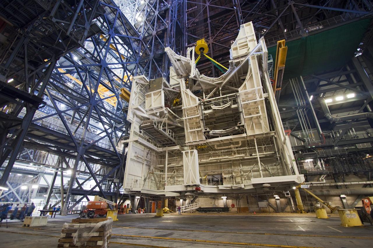 CAPE CANAVERAL, Fla. – As part of NASA's Ground Systems Development and Operations Program at the Kennedy Space Center in Florida, a large space shuttle-era work platform is being lowered and removed from high bay 3 of the Vehicle Assembly Building, or VAB. The work is part of a center-wide modernization and refurbishment initiative to accommodate NASA’s Space Launch System and a variety of other spacecraft instead of the whole building supporting one design. The Ground Systems Development and Operations Program is developing the necessary ground systems, infrastructure and operational approaches required to safely process, assemble, transport and launch the next generation of rockets and spacecraft in support of NASA’s exploration objectives. Future work also will replace the antiquated communications, power and vehicle access resources with modern efficient systems. Some of the utilities and systems slated for replacement have been used since the VAB opened in 1965. For more information, visit http://www.nasa.gov/exploration/systems/ground/index.html Photo credit: NASA/Jim Grossmann