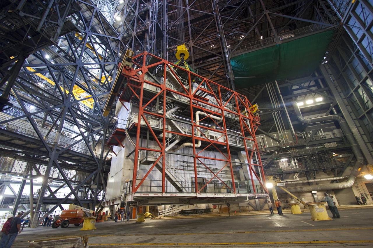 CAPE CANAVERAL, Fla. – As part of NASA's Ground Systems Development and Operations Program at the Kennedy Space Center in Florida, a large space shuttle-era work platform is being lowered and removed from high bay 3 of the Vehicle Assembly Building, or VAB. The work is part of a center-wide modernization and refurbishment initiative to accommodate NASA’s Space Launch System and a variety of other spacecraft instead of the whole building supporting one design. The Ground Systems Development and Operations Program is developing the necessary ground systems, infrastructure and operational approaches required to safely process, assemble, transport and launch the next generation of rockets and spacecraft in support of NASA’s exploration objectives. Future work also will replace the antiquated communications, power and vehicle access resources with modern efficient systems. Some of the utilities and systems slated for replacement have been used since the VAB opened in 1965. For more information, visit http://www.nasa.gov/exploration/systems/ground/index.html Photo credit: NASA/Jim Grossmann
