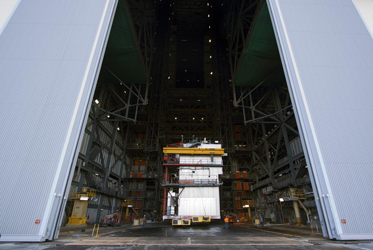 CAPE CANAVERAL, Fla. – As part of NASA's Ground Systems Development and Operations Program at the Kennedy Space Center in Florida, a large space shuttle-era work platform has been removed from high bay 3 of the Vehicle Assembly Building, or VAB. The work is part of a center-wide modernization and refurbishment initiative to accommodate NASA’s Space Launch System and a variety of other spacecraft instead of the whole building supporting one design. The Ground Systems Development and Operations Program is developing the necessary ground systems, infrastructure and operational approaches required to safely process, assemble, transport and launch the next generation of rockets and spacecraft in support of NASA’s exploration objectives. Future work also will replace the antiquated communications, power and vehicle access resources with modern efficient systems. Some of the utilities and systems slated for replacement have been used since the VAB opened in 1965. For more information, visit http://www.nasa.gov/exploration/systems/ground/index.html Photo credit: NASA/Jim Grossmann