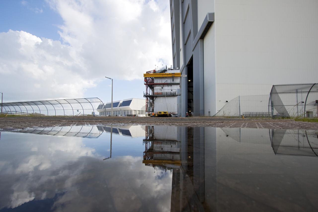 CAPE CANAVERAL, Fla. – As part of NASA's Ground Systems Development and Operations Program at the Kennedy Space Center in Florida, a large space shuttle-era work platform has been removed from high bay 3 of the Vehicle Assembly Building, or VAB. The work is part of a center-wide modernization and refurbishment initiative to accommodate NASA’s Space Launch System and a variety of other spacecraft instead of the whole building supporting one design. The Ground Systems Development and Operations Program is developing the necessary ground systems, infrastructure and operational approaches required to safely process, assemble, transport and launch the next generation of rockets and spacecraft in support of NASA’s exploration objectives. Future work also will replace the antiquated communications, power and vehicle access resources with modern efficient systems. Some of the utilities and systems slated for replacement have been used since the VAB opened in 1965. For more information, visit http://www.nasa.gov/exploration/systems/ground/index.html Photo credit: NASA/Jim Grossmann