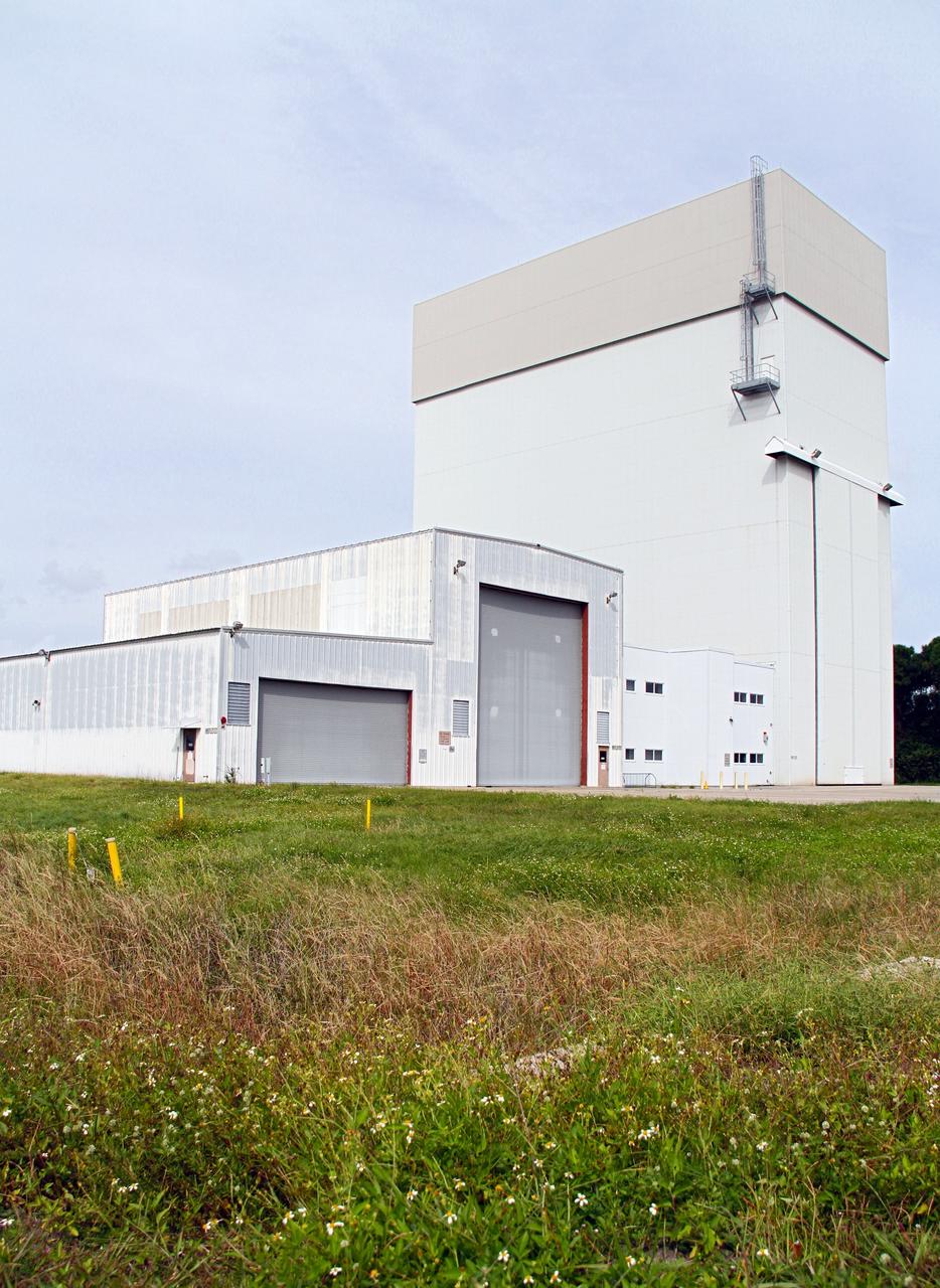 CAPE CANAVERAL, Fla. –The Launch Abort System Facility, or LASF, formerly known as the Canister Rotation Facility, is being outfitted and prepared for use by NASA's Orion Program to process the Launch Abort System, a multi-story rocket that will be positioned atop an Orion capsule to provide an escape system for astronauts during countdown and launch into orbit. The structure, the industrial area of NASA's Kennedy Space Center in Florida, served the Space Shuttle Program by standing the payload canister up so it could be taken to the launch pad and its contents transferred into the shuttle's cargo bay. Photo credit: NASA/Cory Huston