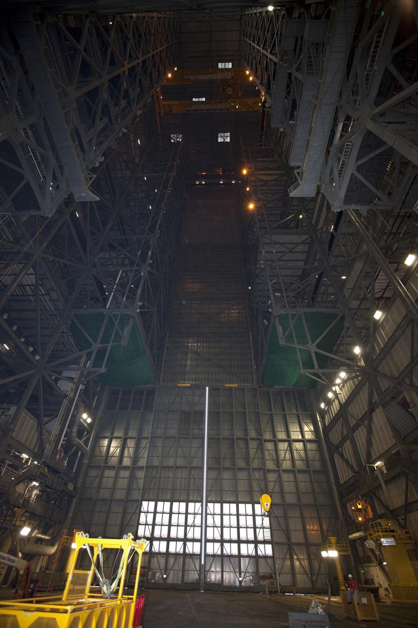CAPE CANAVERAL, Fla. – As part of NASA's Ground Systems Development and Operations Program at the Kennedy Space Center in Florida, space shuttle-era work platforms have been removed from high bay 3 of the Vehicle Assembly Building, or VAB. The work is part of a center-wide modernization and refurbishment initiative to accommodate NASA’s Space Launch System and a variety of other spacecraft instead of the whole building supporting one design. The Ground Systems Development and Operations Program is developing the necessary ground systems, infrastructure and operational approaches required to safely process, assemble, transport and launch the next generation of rockets and spacecraft in support of NASA’s exploration objectives. Future work also will replace the antiquated communications, power and vehicle access resources with modern efficient systems. Some of the utilities and systems slated for replacement have been used since the VAB opened in 1965. For more information, visit http://www.nasa.gov/exploration/systems/ground/index.html Photo credit: NASA/Kim Shiflett