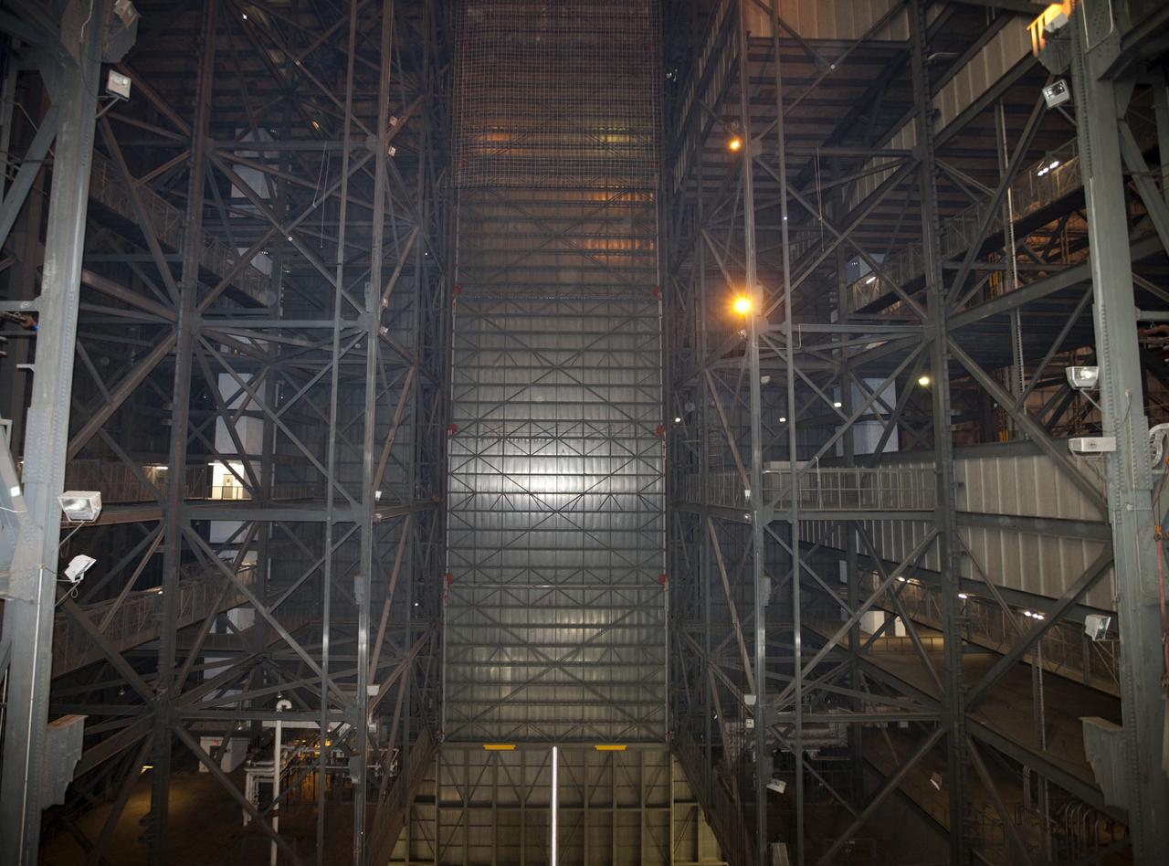 CAPE CANAVERAL, Fla. – As part of NASA's Ground Systems Development and Operations Program at the Kennedy Space Center in Florida, space shuttle-era work platforms have been removed from high bay 3 of the Vehicle Assembly Building, or VAB. The work is part of a center-wide modernization and refurbishment initiative to accommodate NASA’s Space Launch System and a variety of other spacecraft instead of the whole building supporting one design. The Ground Systems Development and Operations Program is developing the necessary ground systems, infrastructure and operational approaches required to safely process, assemble, transport and launch the next generation of rockets and spacecraft in support of NASA’s exploration objectives. Future work also will replace the antiquated communications, power and vehicle access resources with modern efficient systems. Some of the utilities and systems slated for replacement have been used since the VAB opened in 1965. For more information, visit http://www.nasa.gov/exploration/systems/ground/index.html Photo credit: NASA/Kim Shiflett
