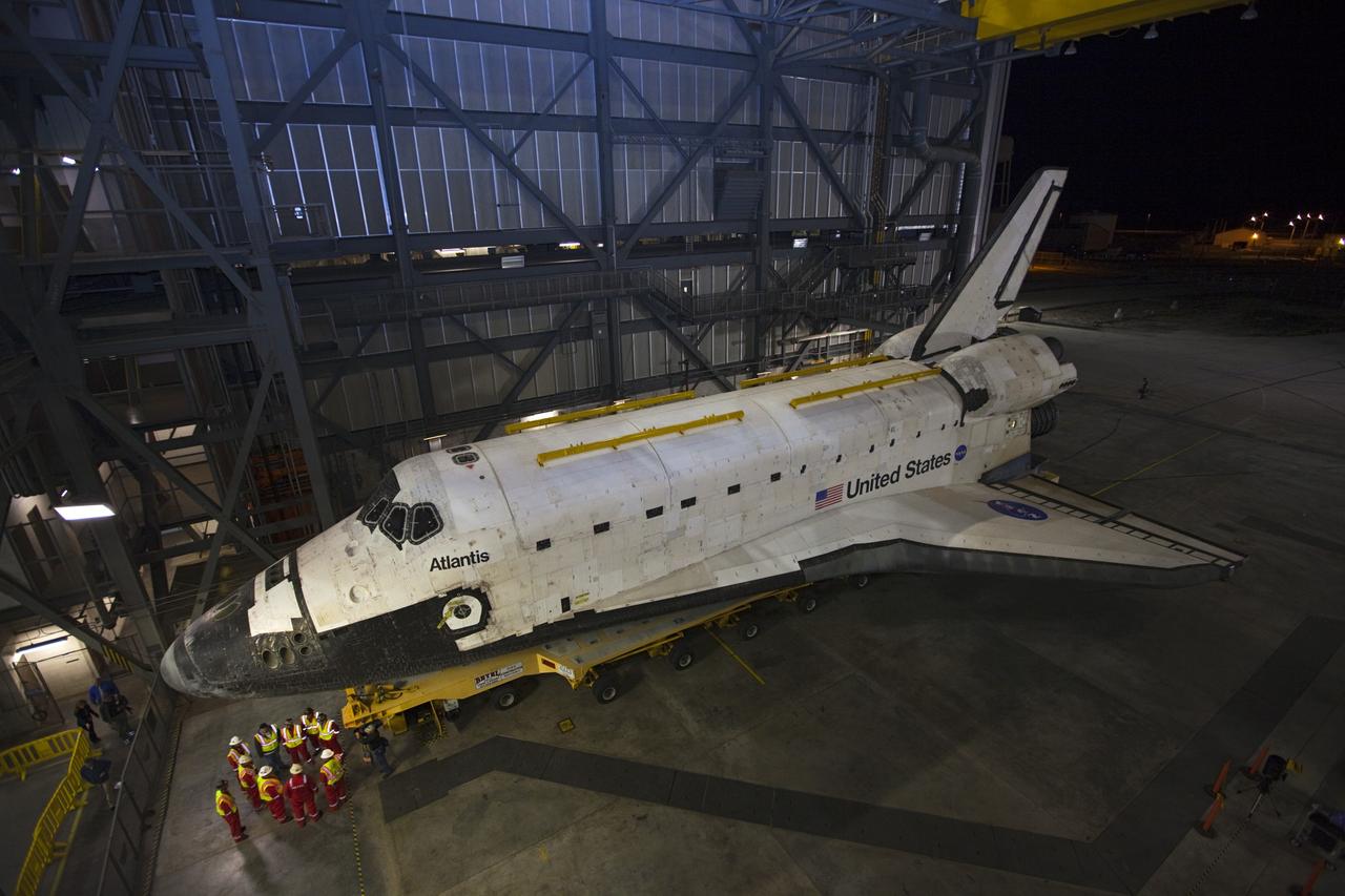 CAPE CANAVERAL, Fla. – Space shuttle Atlantis backs out of the Vehicle Assembly Building at NASA's Kennedy Space Center in Florida for its 10-mile trip to the Kennedy Visitor Complex where it will be put on public display. As part of transition and retirement of the Space Shuttle Program, Atlantis is to be displayed at Kennedy's Visitor Complex beginning in the summer of 2013. Over the course of its 26-year career, Atlantis traveled 125,935,769 miles during 307 days in space over 33 missions. For more information, visit http://www.nasa.gov/transition Photo credit: NASA/ Kim Shiflett