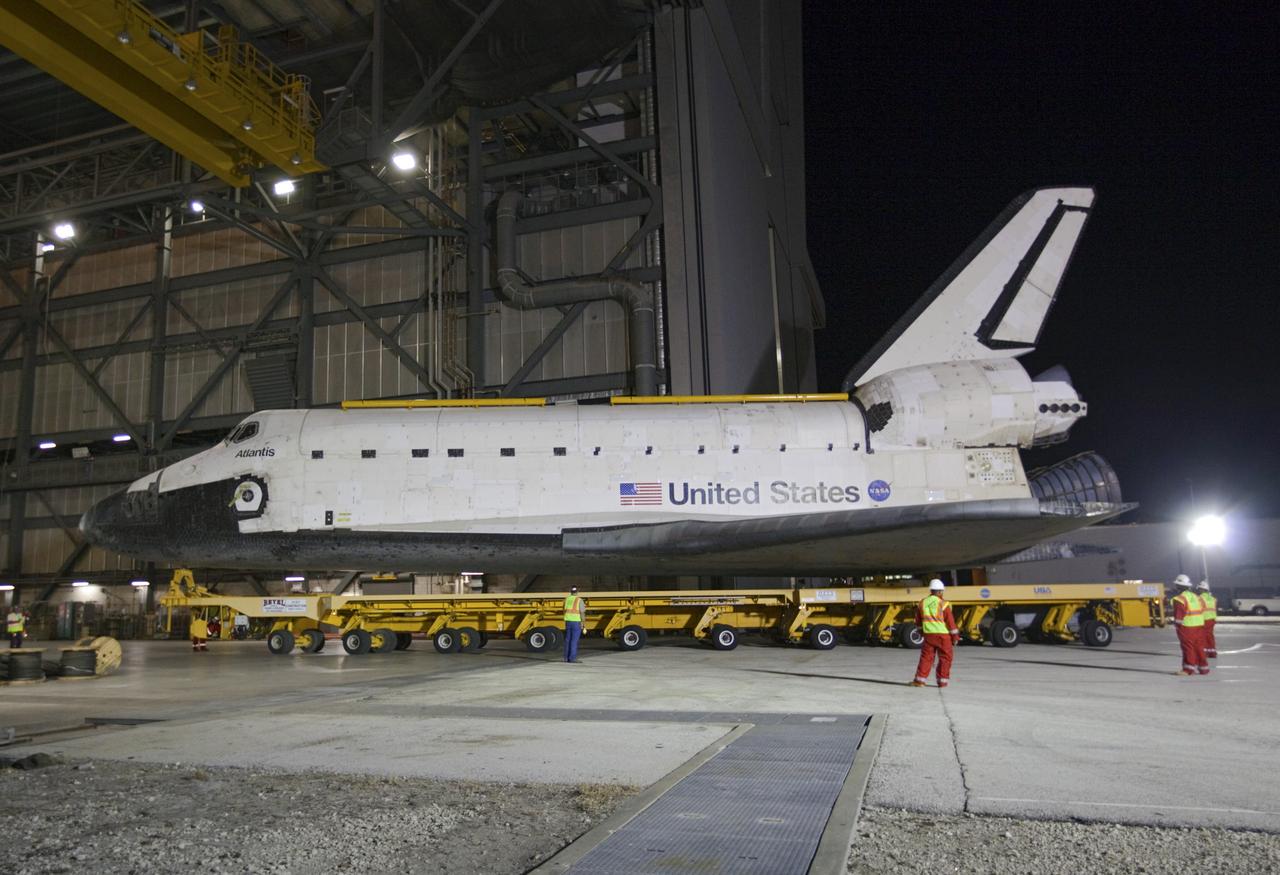 CAPE CANAVERAL, Fla. – Space shuttle Atlantis backs out of the Vehicle Assembly Building at NASA's Kennedy Space Center in Florida for its 10-mile trip to the Kennedy Visitor Complex where it will be put on public display. As part of transition and retirement of the Space Shuttle Program, Atlantis is to be displayed at Kennedy's Visitor Complex beginning in the summer of 2013. Over the course of its 26-year career, Atlantis traveled 125,935,769 miles during 307 days in space over 33 missions. For more information, visit http://www.nasa.gov/transition Photo credit: NASA/ Kim Shiflett
