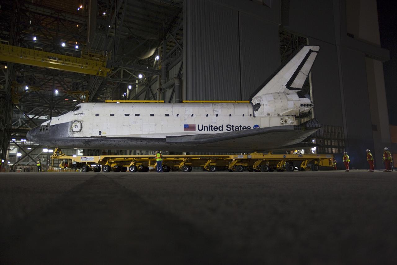 CAPE CANAVERAL, Fla. – Space shuttle Atlantis backs out of the Vehicle Assembly Building at NASA's Kennedy Space Center in Florida for its 10-mile trip to the Kennedy Visitor Complex where it will be put on public display. As part of transition and retirement of the Space Shuttle Program, Atlantis is to be displayed at Kennedy's Visitor Complex beginning in the summer of 2013. Over the course of its 26-year career, Atlantis traveled 125,935,769 miles during 307 days in space over 33 missions. For more information, visit http://www.nasa.gov/transition Photo credit: NASA/ Kim Shiflett