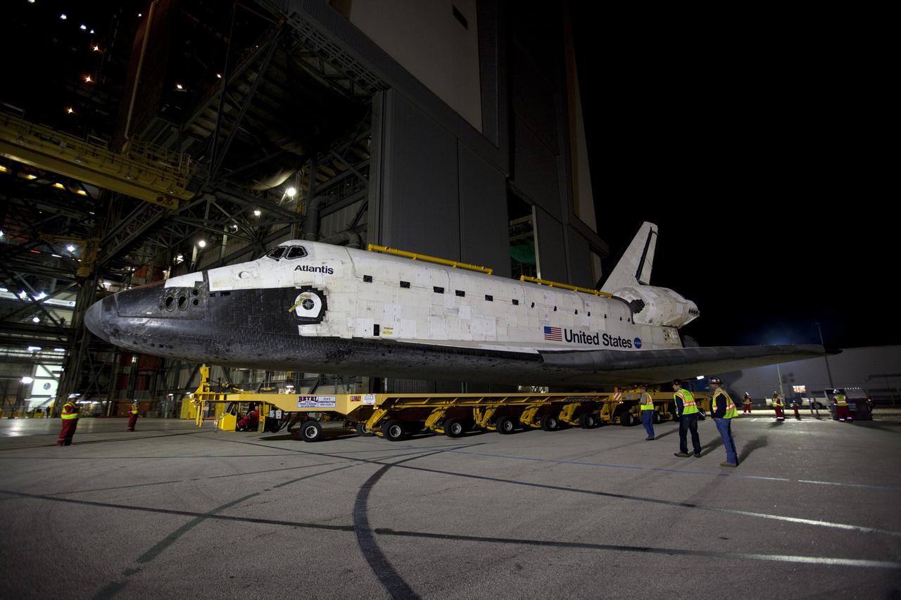 CAPE CANAVERAL, Fla. – Space shuttle Atlantis moves out of the Vehicle Assembly Building at NASA's Kennedy Space Center in Florida for its 10-mile trip to the Kennedy Visitor Complex where it will be put on public display. As part of transition and retirement of the Space Shuttle Program, Atlantis is to be displayed at Kennedy's Visitor Complex beginning in the summer of 2013. Over the course of its 26-year career, Atlantis traveled 125,935,769 miles during 307 days in space over 33 missions. For more information, visit http://www.nasa.gov/transition Photo credit: NASA/ Kim Shiflett