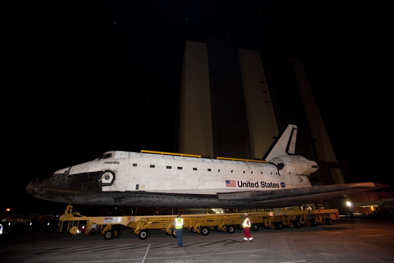 CAPE CANAVERAL, Fla. – Space shuttle Atlantis moves out of the Vehicle Assembly Building at NASA's Kennedy Space Center in Florida for its 10-mile trip to the Kennedy Visitor Complex where it will be put on public display. As part of transition and retirement of the Space Shuttle Program, Atlantis is to be displayed at Kennedy's Visitor Complex beginning in the summer of 2013. Over the course of its 26-year career, Atlantis traveled 125,935,769 miles during 307 days in space over 33 missions. For more information, visit http://www.nasa.gov/transition Photo credit: NASA/ Kim Shiflett