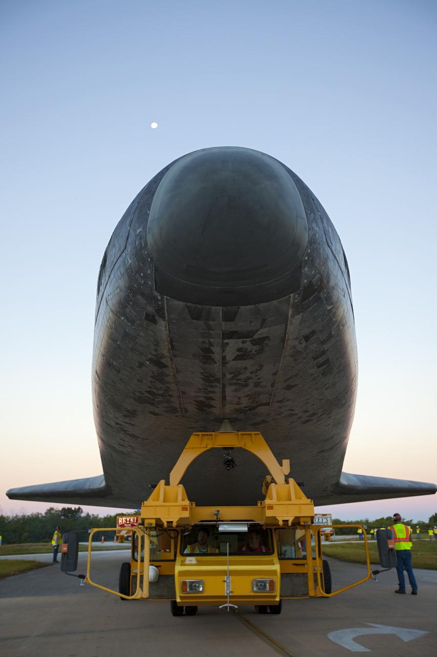CAPE CANAVERAL, Fla. – The moon is overhead at NASA's Kennedy Space Center in Florida, as the space shuttle Atlantis is transported on a 10-mile journey to the Kennedy Visitor Complex where it will be put on public display. As part of transition and retirement of the Space Shuttle Program, Atlantis is to be displayed at Kennedy's Visitor Complex beginning in the summer of 2013. Over the course of its 26-year career, Atlantis traveled 125,935,769 miles during 307 days in space over 33 missions. For more information, visit http://www.nasa.gov/transition Photo credit: NASA/ Kim Shiflett