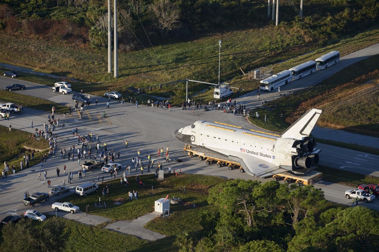 CAPE CANAVERAL, Fla. – Space shuttle Atlantis is transported along Kennedy Parkway at NASA's Kennedy Space Center in Florida on its 10-mile journey to the Kennedy Visitor Complex where it will be put on public display. As part of transition and retirement of the Space Shuttle Program, Atlantis is to be displayed at Kennedy's Visitor Complex beginning in the summer of 2013. Over the course of its 26-year career, Atlantis traveled 125,935,769 miles during 307 days in space over 33 missions. For more information, visit http://www.nasa.gov/transition Photo credit: NASA/ Kim Shiflett