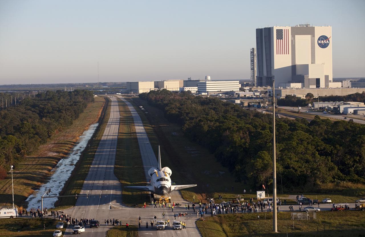 CAPE CANAVERAL, Fla. – Space shuttle Atlantis is transported along Kennedy Parkway at NASA's Kennedy Space Center in Florida on its 10-mile journey to the Kennedy Visitor Complex where it will be put on public display. As part of transition and retirement of the Space Shuttle Program, Atlantis is to be displayed at Kennedy's Visitor Complex beginning in the summer of 2013. Over the course of its 26-year career, Atlantis traveled 125,935,769 miles during 307 days in space over 33 missions. For more information, visit http://www.nasa.gov/transition Photo credit: NASA/ Kim Shiflett