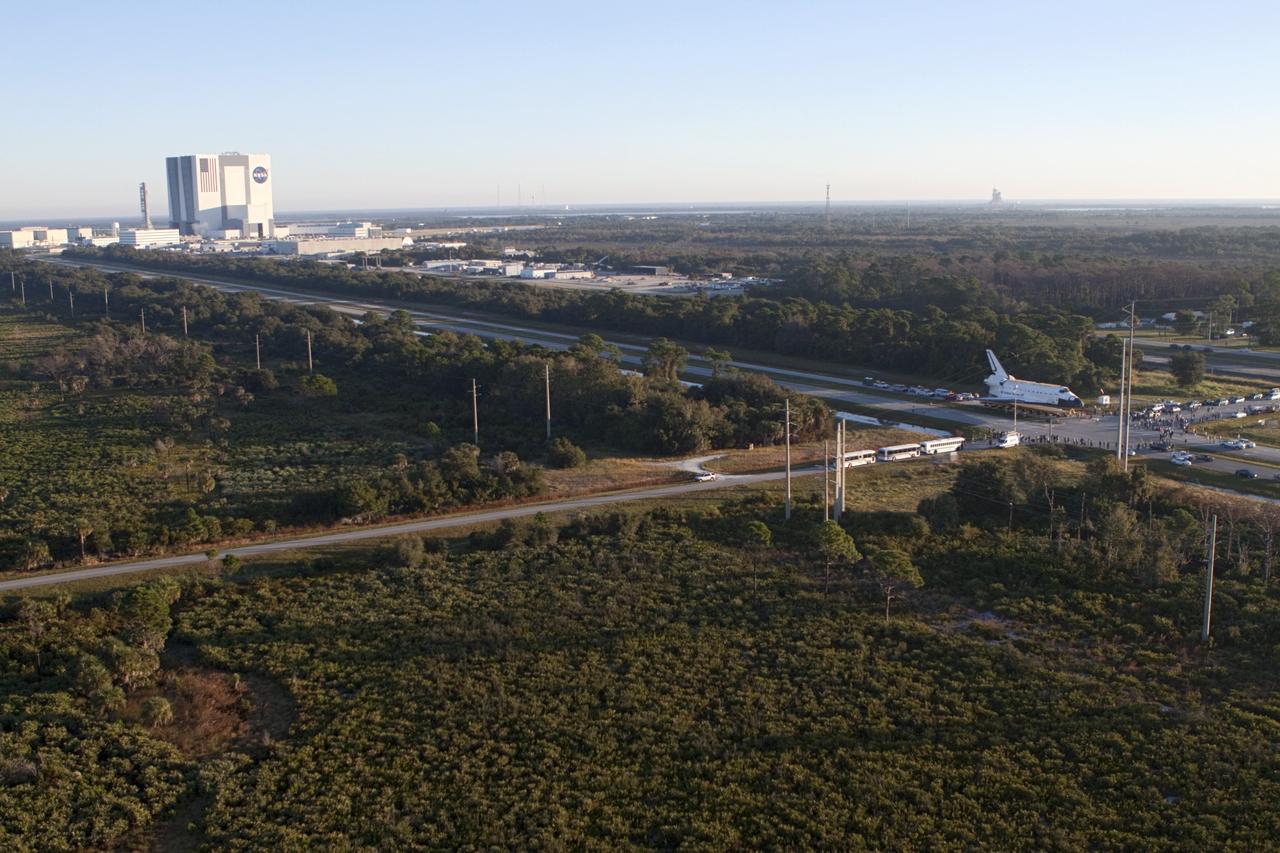 CAPE CANAVERAL, Fla. – Space shuttle Atlantis is transported along Kennedy Parkway at NASA's Kennedy Space Center in Florida on its 10-mile journey to the Kennedy Visitor Complex where it will be put on public display. As part of transition and retirement of the Space Shuttle Program, Atlantis is to be displayed at Kennedy's Visitor Complex beginning in the summer of 2013. Over the course of its 26-year career, Atlantis traveled 125,935,769 miles during 307 days in space over 33 missions. For more information, visit http://www.nasa.gov/transition Photo credit: NASA/ Kim Shiflett