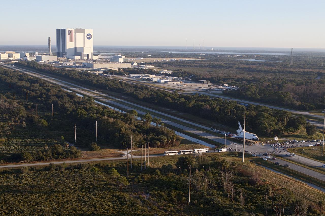 CAPE CANAVERAL, Fla. – Space shuttle Atlantis is transported along Kennedy Parkway at NASA's Kennedy Space Center in Florida on its 10-mile journey to the Kennedy Visitor Complex where it will be put on public display. As part of transition and retirement of the Space Shuttle Program, Atlantis is to be displayed at Kennedy's Visitor Complex beginning in the summer of 2013. Over the course of its 26-year career, Atlantis traveled 125,935,769 miles during 307 days in space over 33 missions. For more information, visit http://www.nasa.gov/transition Photo credit: NASA/ Kim Shiflett
