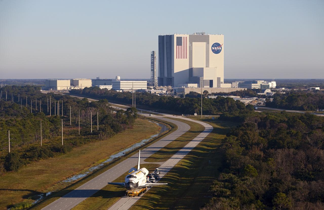 CAPE CANAVERAL, Fla. – Space shuttle Atlantis is transported along Kennedy Parkway at NASA's Kennedy Space Center in Florida on its 10-mile journey to the Kennedy Visitor Complex where it will be put on public display. As part of transition and retirement of the Space Shuttle Program, Atlantis is to be displayed at Kennedy's Visitor Complex beginning in the summer of 2013. Over the course of its 26-year career, Atlantis traveled 125,935,769 miles during 307 days in space over 33 missions. For more information, visit http://www.nasa.gov/transition Photo credit: NASA/ Kim Shiflett