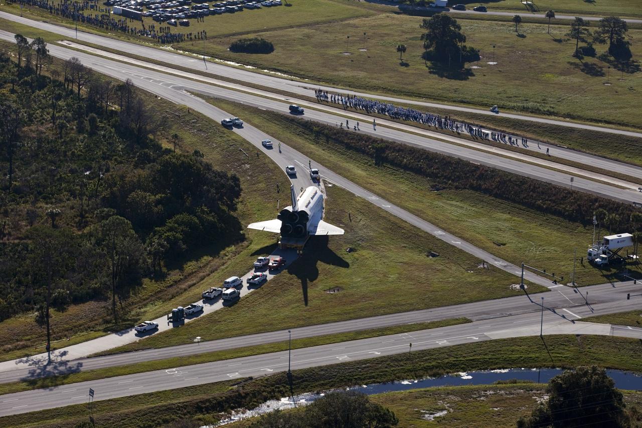 CAPE CANAVERAL, Fla. – Space shuttle Atlantis approaches NASA Causeway at NASA's Kennedy Space Center in Florida as it is transported on its 10-mile journey to the Kennedy Space Center Visitor Complex where it will be put on public display. As part of transition and retirement of the Space Shuttle Program, Atlantis is to be displayed at Kennedy's Visitor Complex beginning in the summer of 2013. Over the course of its 26-year career, Atlantis traveled 125,935,769 miles during 307 days in space over 33 missions. For more information, visit http://www.nasa.gov/transition Photo credit: NASA/ Kim Shiflett