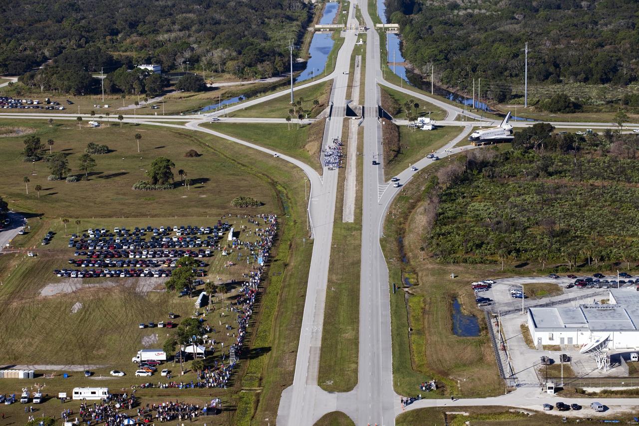 CAPE CANAVERAL, Fla. – Space shuttle Atlantis approaches NASA Causeway at NASA's Kennedy Space Center in Florida as it is transported on its 10-mile journey to the Kennedy Space Center Visitor Complex where it will be put on public display. As part of transition and retirement of the Space Shuttle Program, Atlantis is to be displayed at Kennedy's Visitor Complex beginning in the summer of 2013. Over the course of its 26-year career, Atlantis traveled 125,935,769 miles during 307 days in space over 33 missions. For more information, visit http://www.nasa.gov/transition Photo credit: NASA/ Kim Shiflett