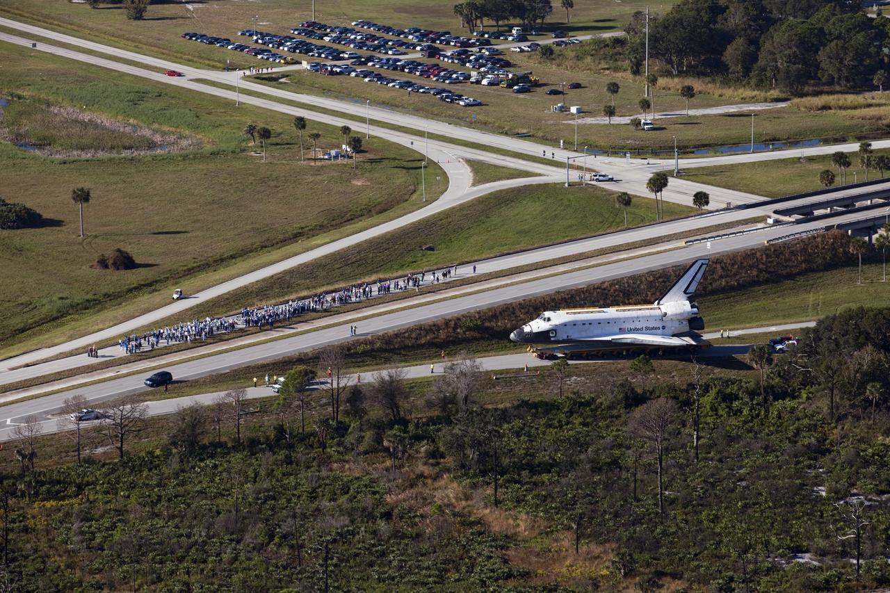 CAPE CANAVERAL, Fla. – Space shuttle Atlantis approaches NASA Causeway at NASA's Kennedy Space Center in Florida as it is transported on its 10-mile journey to the Kennedy Space Center Visitor Complex where it will be put on public display. As part of transition and retirement of the Space Shuttle Program, Atlantis is to be displayed at Kennedy's Visitor Complex beginning in the summer of 2013. Over the course of its 26-year career, Atlantis traveled 125,935,769 miles during 307 days in space over 33 missions. For more information, visit http://www.nasa.gov/transition Photo credit: NASA/ Kim Shiflett