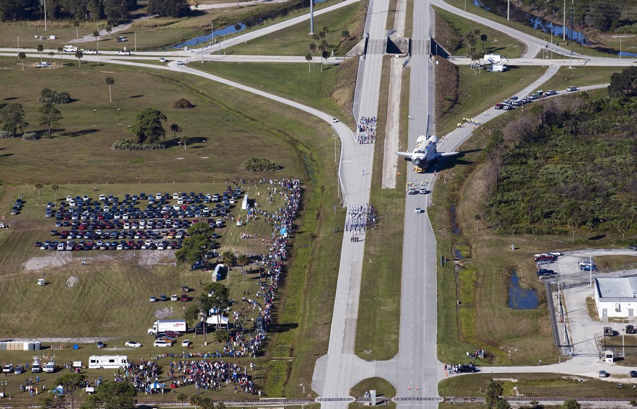 CAPE CANAVERAL, Fla. – Space shuttle Atlantis is transported along NASA Causeway at NASA's Kennedy Space Center in Florida on its 10-mile journey to the Kennedy Space Center Visitor Complex where it will be put on public display. As part of transition and retirement of the Space Shuttle Program, Atlantis is to be displayed at Kennedy's Visitor Complex beginning in the summer of 2013. Over the course of its 26-year career, Atlantis traveled 125,935,769 miles during 307 days in space over 33 missions. For more information, visit http://www.nasa.gov/transition Photo credit: NASA/ Kim Shiflett