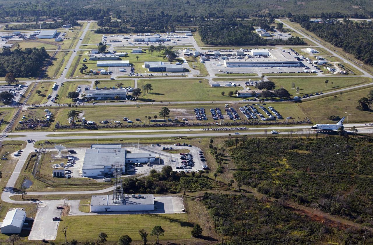 CAPE CANAVERAL, Fla. – Space shuttle Atlantis is transported along NASA Causeway at NASA's Kennedy Space Center in Florida on its 10-mile journey to the Kennedy Space Center Visitor Complex where it will be put on public display. As part of transition and retirement of the Space Shuttle Program, Atlantis is to be displayed at Kennedy's Visitor Complex beginning in the summer of 2013. Over the course of its 26-year career, Atlantis traveled 125,935,769 miles during 307 days in space over 33 missions. For more information, visit http://www.nasa.gov/transition Photo credit: NASA/ Kim Shiflett