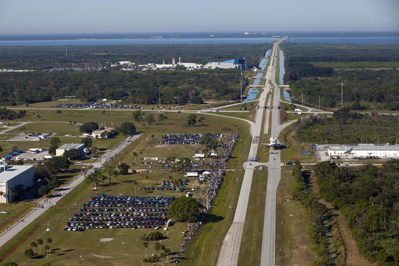 CAPE CANAVERAL, Fla. – Space shuttle Atlantis is transported along NASA Causeway at NASA's Kennedy Space Center in Florida on its 10-mile journey to the Kennedy Space Center Visitor Complex where it will be put on public display. As part of transition and retirement of the Space Shuttle Program, Atlantis is to be displayed at Kennedy's Visitor Complex beginning in the summer of 2013. Over the course of its 26-year career, Atlantis traveled 125,935,769 miles during 307 days in space over 33 missions. For more information, visit http://www.nasa.gov/transition Photo credit: NASA/ Kim Shiflett
