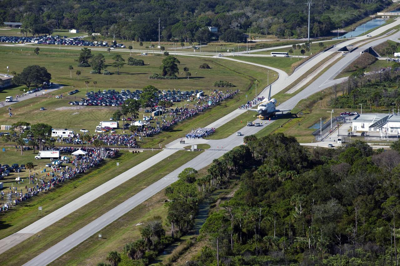 CAPE CANAVERAL, Fla. – Space shuttle Atlantis is transported along NASA Causeway at NASA's Kennedy Space Center in Florida on its 10-mile journey to the Kennedy Space Center Visitor Complex where it will be put on public display. As part of transition and retirement of the Space Shuttle Program, Atlantis is to be displayed at Kennedy's Visitor Complex beginning in the summer of 2013. Over the course of its 26-year career, Atlantis traveled 125,935,769 miles during 307 days in space over 33 missions. For more information, visit http://www.nasa.gov/transition Photo credit: NASA/ Kim Shiflett