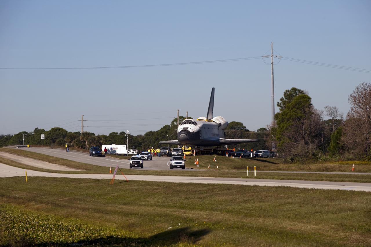 CAPE CANAVERAL, Fla. – Space shuttle Atlantis approaches NASA Causeway at NASA's Kennedy Space Center in Florida as it is transported on its 10-mile journey to the Kennedy Space Center Visitor Complex where it will be put on public display. As part of transition and retirement of the Space Shuttle Program, Atlantis is to be displayed at Kennedy's Visitor Complex beginning in the summer of 2013. Over the course of its 26-year career, Atlantis traveled 125,935,769 miles during 307 days in space over 33 missions. For more information, visit http://www.nasa.gov/transition Photo credit: NASA/ Tony Gray