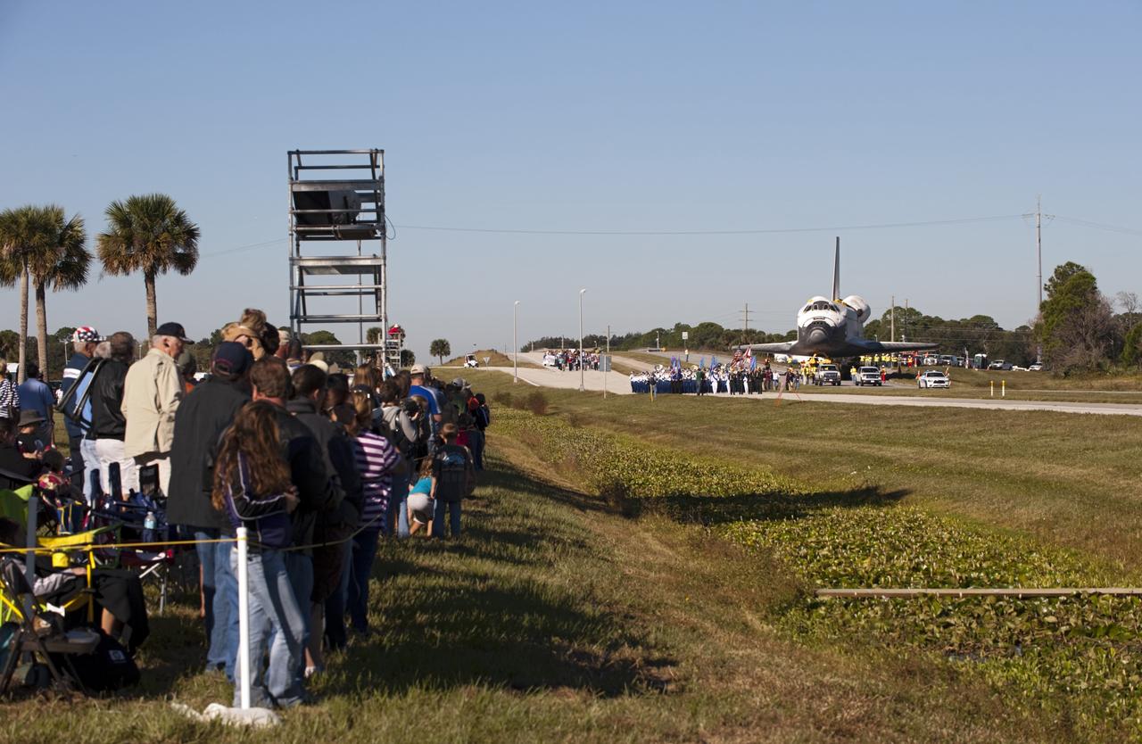 CAPE CANAVERAL, Fla. – Space shuttle Atlantis approaches NASA Causeway at NASA's Kennedy Space Center in Florida as it is transported on its 10-mile journey to the Kennedy Space Center Visitor Complex where it will be put on public display. As part of transition and retirement of the Space Shuttle Program, Atlantis is to be displayed at Kennedy's Visitor Complex beginning in the summer of 2013. Over the course of its 26-year career, Atlantis traveled 125,935,769 miles during 307 days in space over 33 missions. For more information, visit http://www.nasa.gov/transition Photo credit: NASA/ Tony Gray
