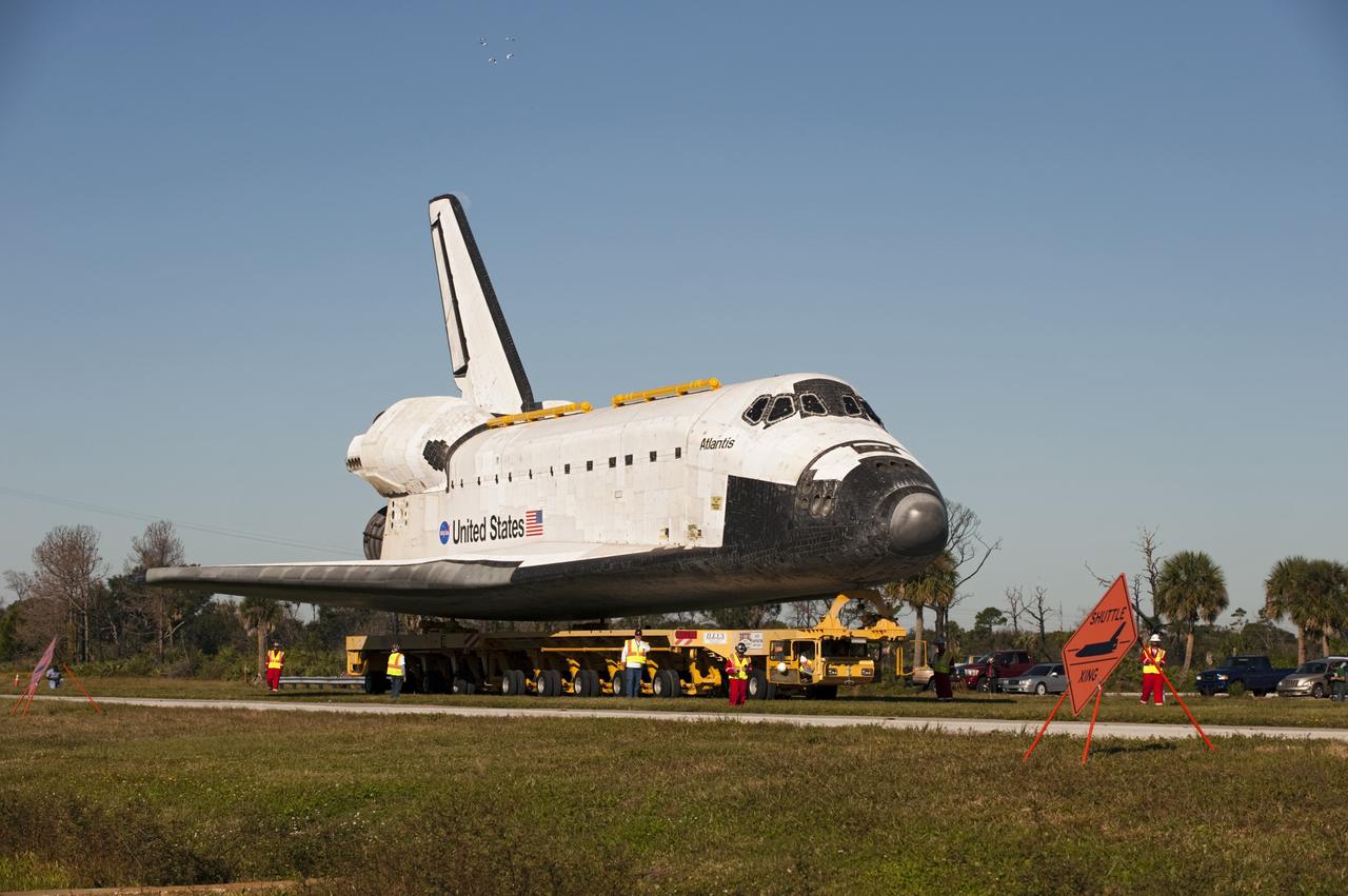 CAPE CANAVERAL, Fla. – Space shuttle Atlantis is transported along NASA Causeway at NASA's Kennedy Space Center in Florida on its 10-mile journey to the Kennedy Space Center Visitor Complex where it will be put on public display. As part of transition and retirement of the Space Shuttle Program, Atlantis is to be displayed at Kennedy's Visitor Complex beginning in the summer of 2013. Over the course of its 26-year career, Atlantis traveled 125,935,769 miles during 307 days in space over 33 missions. For more information, visit http://www.nasa.gov/transition Photo credit: NASA/ Tony Gray