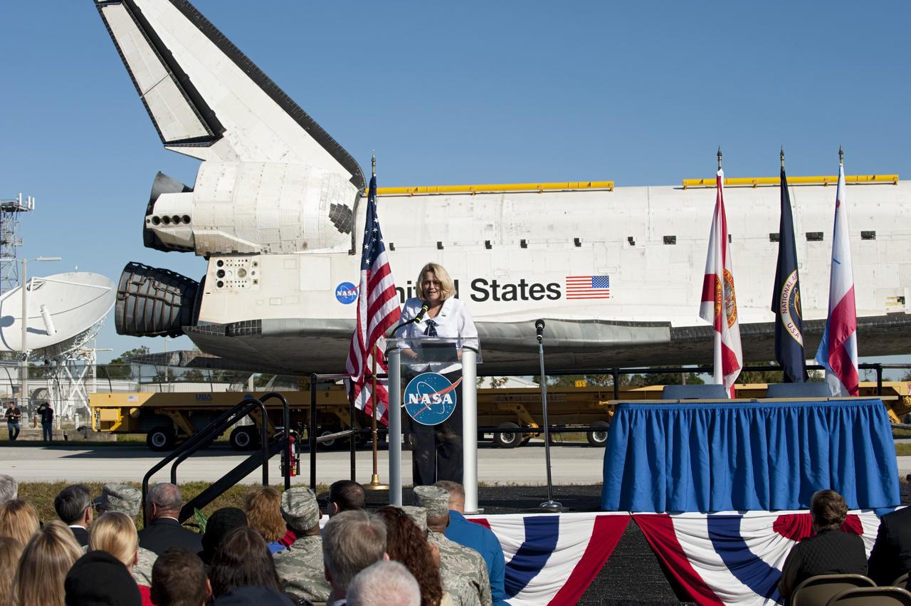 CAPE CANAVERAL, Fla. – At NASA's Kennedy Space Center in Florida, the space shuttle Atlantis pauses during its 10-mile journey to the Kennedy Visitor Complex for a ceremony to commemorate the transfer. NASA Director of Education and External Relations Cheryl Hurst welcomes Kennedy employees and guests to the event.      As part of transition and retirement of the Space Shuttle Program, Atlantis is to be displayed at Kennedy's Visitor Complex beginning in the summer of 2013. Over the course of its 26-year career, Atlantis traveled 125,935,769 miles during 307 days in space over 33 missions. For more information, visit http://www.nasa.gov/transition Photo credit: NASA/ Tony Gray