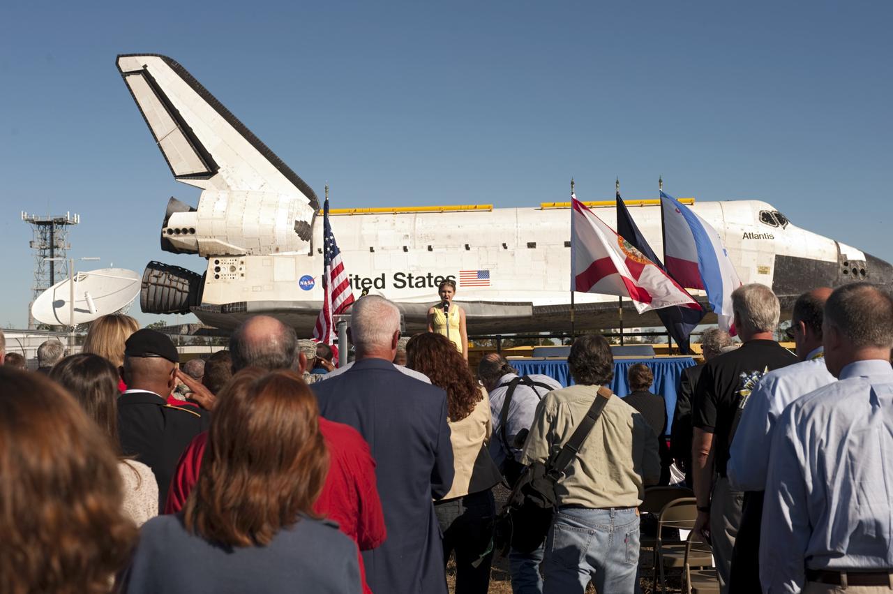 CAPE CANAVERAL, Fla. – At NASA's Kennedy Space Center in Florida, the space shuttle Atlantis pauses during its 10-mile journey to the Kennedy Visitor Complex for a ceremony to commemorate the transfer. Kennedy Middle School student Searra Weeks sang the National Anthem to begin the event.      As part of transition and retirement of the Space Shuttle Program, Atlantis is to be displayed at Kennedy's Visitor Complex beginning in the summer of 2013. Over the course of its 26-year career, Atlantis traveled 125,935,769 miles during 307 days in space over 33 missions. For more information, visit http://www.nasa.gov/transition Photo credit: NASA/ Tony Gray