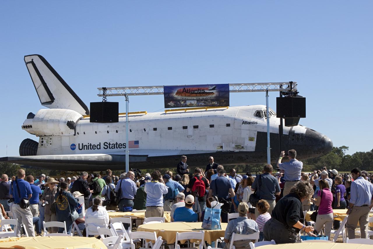 CAPE CANAVERAL, Fla. – Kennedy Space Center Director Bob Cabana, left, and NASA Administrator Charles Bolden speak to guests at Space Florida's Exploration Park where the space shuttle Atlantis pauses during its 10-mile journey to the Kennedy Visitor Complex. As part of transition and retirement of the Space Shuttle Program, Atlantis is to be displayed at Kennedy's Visitor Complex beginning in the summer of 2013. Over the course of its 26-year career, Atlantis traveled 125,935,769 miles during 307 days in space over 33 missions. For more information, visit http://www.nasa.gov/transition Photo credit: NASA/ Jim Grossmann