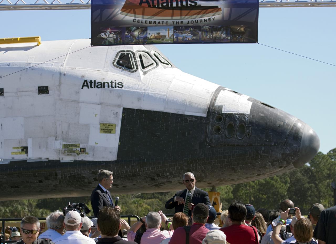 CAPE CANAVERAL, Fla. – Kennedy Space Center Director Bob Cabana, left, and NASA Administrator Charles Bolden speak to guests at Space Florida's Exploration Park where the space shuttle Atlantis pauses during its 10-mile journey to the Kennedy Visitor Complex. As part of transition and retirement of the Space Shuttle Program, Atlantis is to be displayed at Kennedy's Visitor Complex beginning in the summer of 2013. Over the course of its 26-year career, Atlantis traveled 125,935,769 miles during 307 days in space over 33 missions. For more information, visit http://www.nasa.gov/transition Photo credit: NASA/ Jim Grossmann