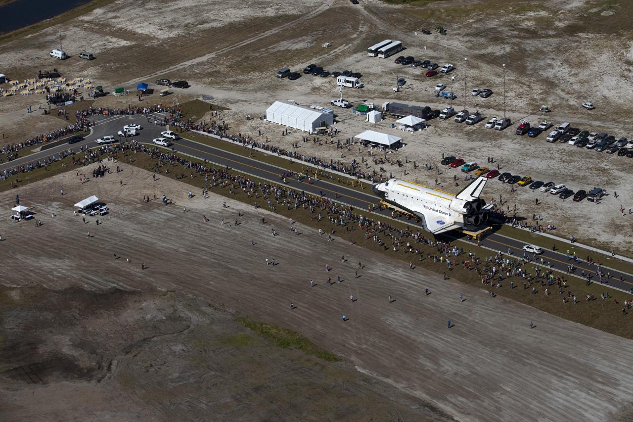 CAPE CANAVERAL, Fla. – At NASA's Kennedy Space Center in Florida, space shuttle Atlantis travels through Space Florida's Exploration Park during its 10-mile journey from the Vehicle Assembly Building to the Kennedy Space Center Visitor Complex. Atlantis will stop in the park for a viewing opportunity for visitor complex guests before completing the trip to its new home. As part of transition and retirement of the Space Shuttle Program, Atlantis will be displayed in a new exhibit hall at the visitor complex beginning in the summer of 2013. Over the course of its 26-year career, Atlantis traveled 125,935,769 miles, completing 33 missions during 307 days in space. For more information, visit http://www.nasa.gov/transition. Photo credit: NASA/Kim Shiflett