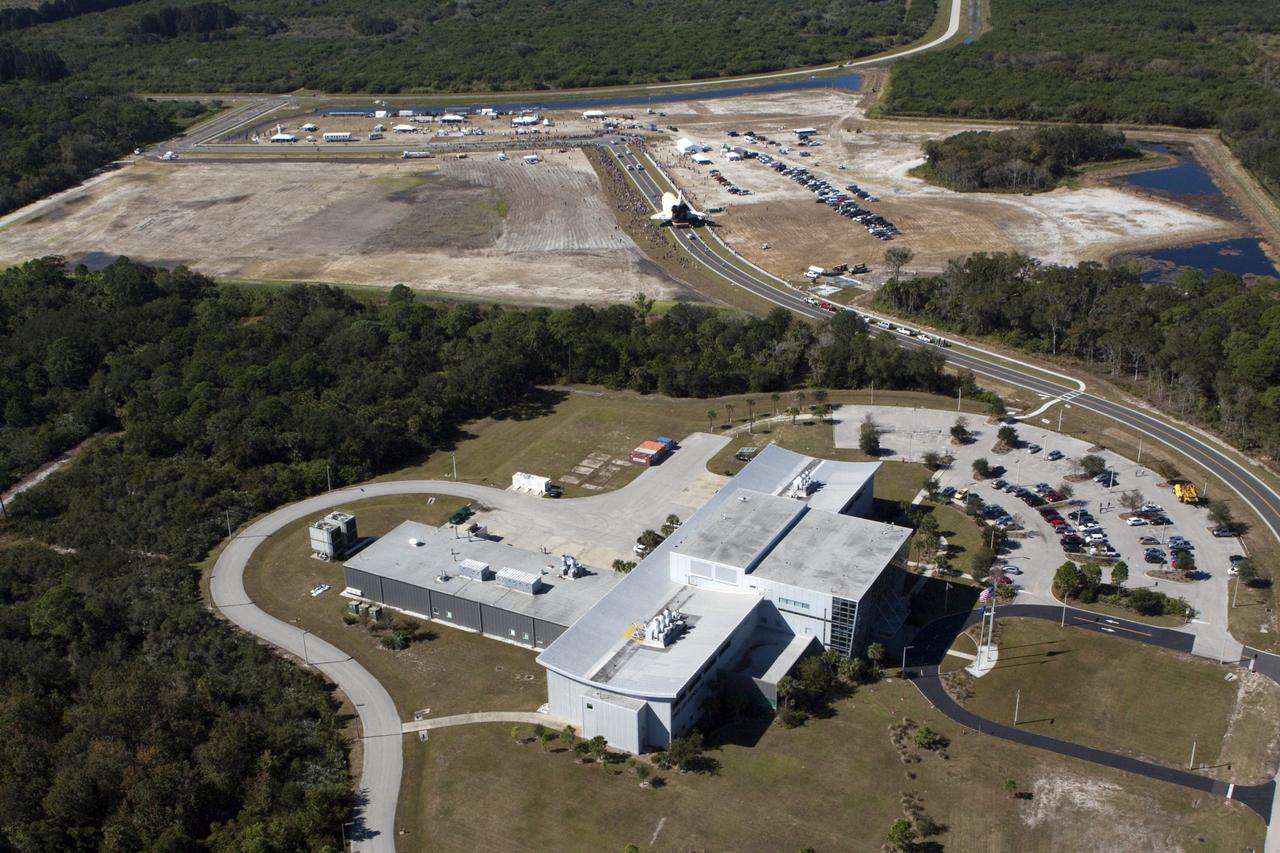 CAPE CANAVERAL, Fla. – At NASA's Kennedy Space Center in Florida, space shuttle Atlantis travels through Space Florida's Exploration Park during its 10-mile journey from the Vehicle Assembly Building to the Kennedy Space Center Visitor Complex. Atlantis will stop in the park for a viewing opportunity for visitor complex guests before completing the trip to its new home. As part of transition and retirement of the Space Shuttle Program, Atlantis will be displayed in a new exhibit hall at the visitor complex beginning in the summer of 2013. Over the course of its 26-year career, Atlantis traveled 125,935,769 miles, completing 33 missions during 307 days in space. For more information, visit http://www.nasa.gov/transition. Photo credit: NASA/Kim Shiflett