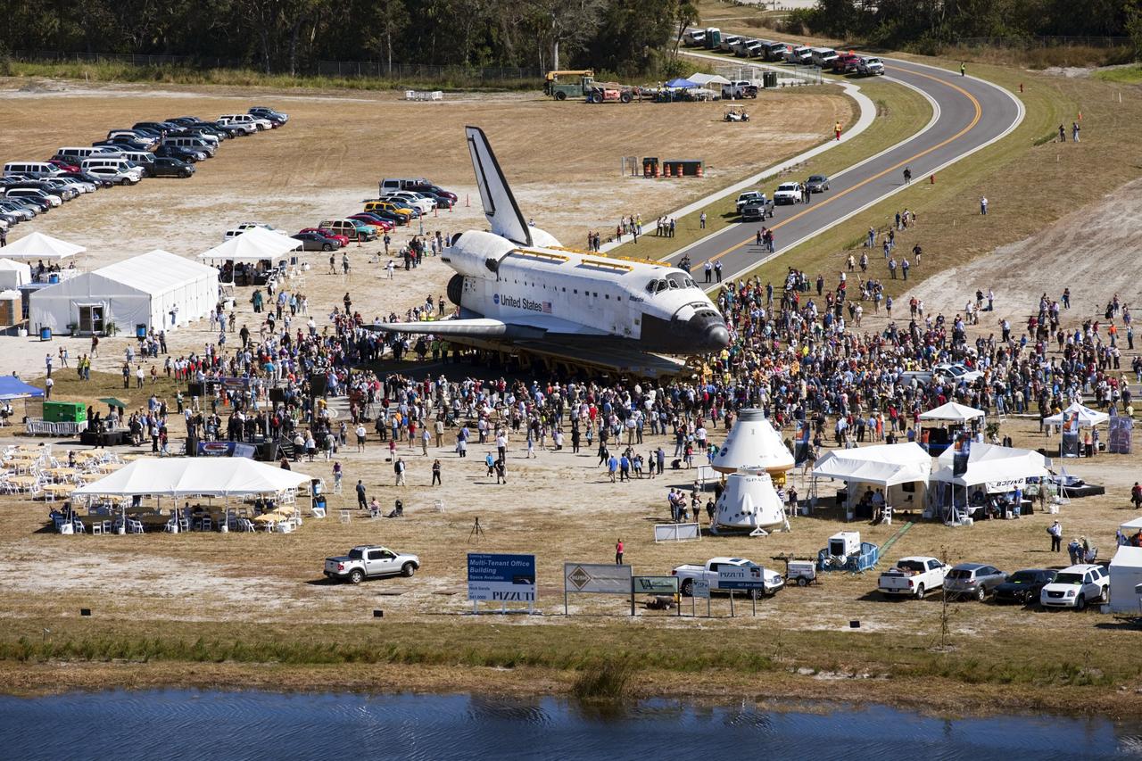 CAPE CANAVERAL, Fla. – At NASA's Kennedy Space Center in Florida, a crowd swarms space shuttle Atlantis in Space Florida's Exploration Park during its 10-mile journey from the Vehicle Assembly Building to the Kennedy Space Center Visitor Complex. Atlantis stopped in the park for a viewing opportunity for visitor complex guests before completing the trip to its new home. As part of transition and retirement of the Space Shuttle Program, Atlantis will be displayed in a new exhibit hall at the visitor complex beginning in the summer of 2013. Over the course of its 26-year career, Atlantis traveled 125,935,769 miles, completing 33 missions during 307 days in space. For more information, visit http://www.nasa.gov/transition. Photo credit: NASA/Kim Shiflett